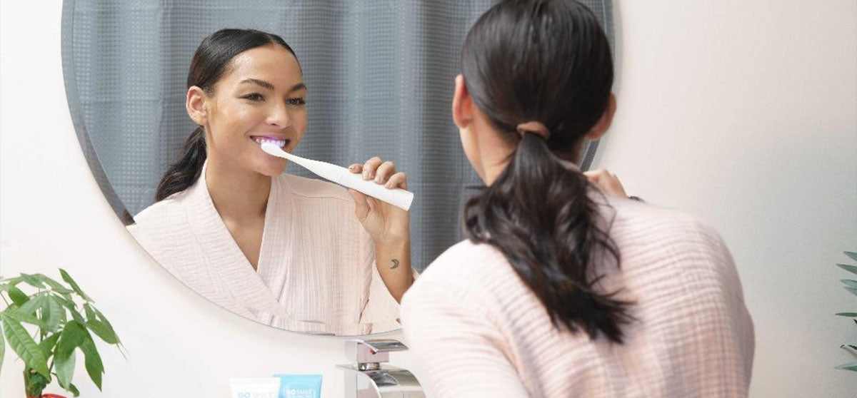 woman brushing teeth