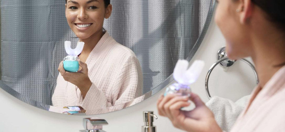 woman using go smile toothbrush